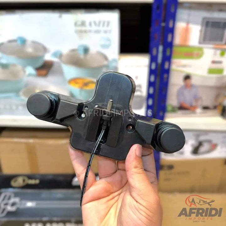 Black plastic car phone mount with a charging cable.
