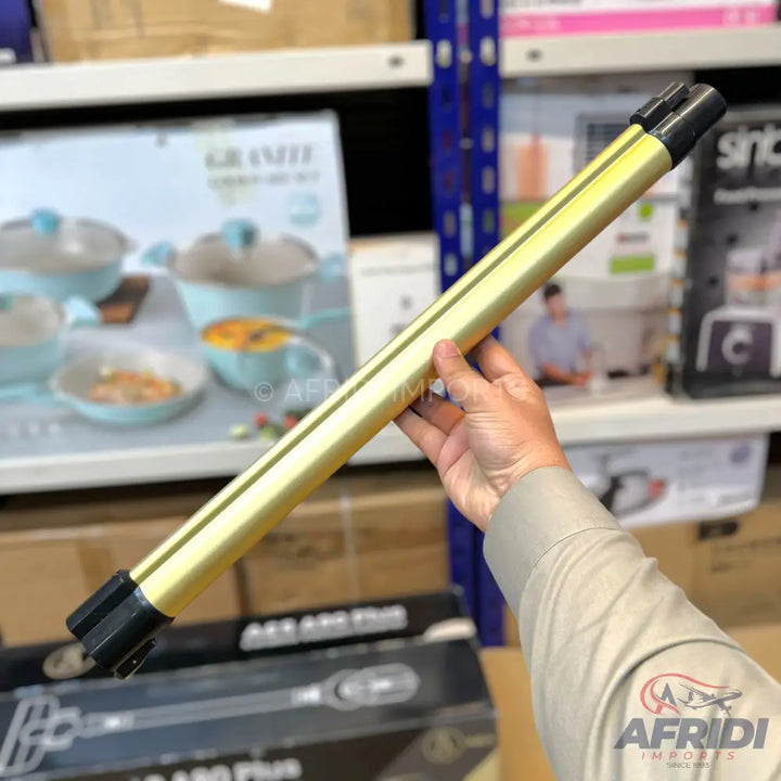 A gold-colored, rectangular-shaped metal pole with black plastic caps on both ends.