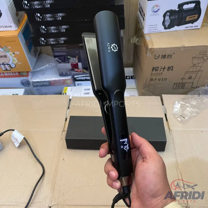 Black hair straightener with a digital temperature display.
