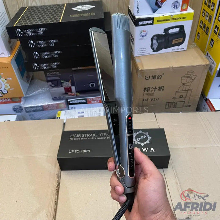 A silver and black hair straightener with digital temperature control.