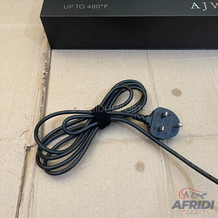 Black power cord with a British type G plug.