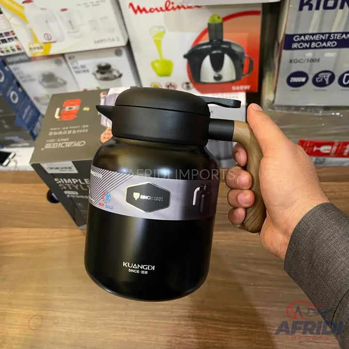 Black insulated thermos with a wooden handle.
