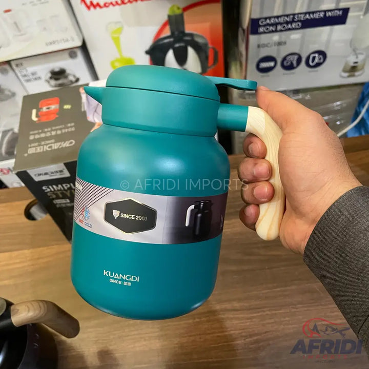 Teal insulated thermos with a light wooden handle.