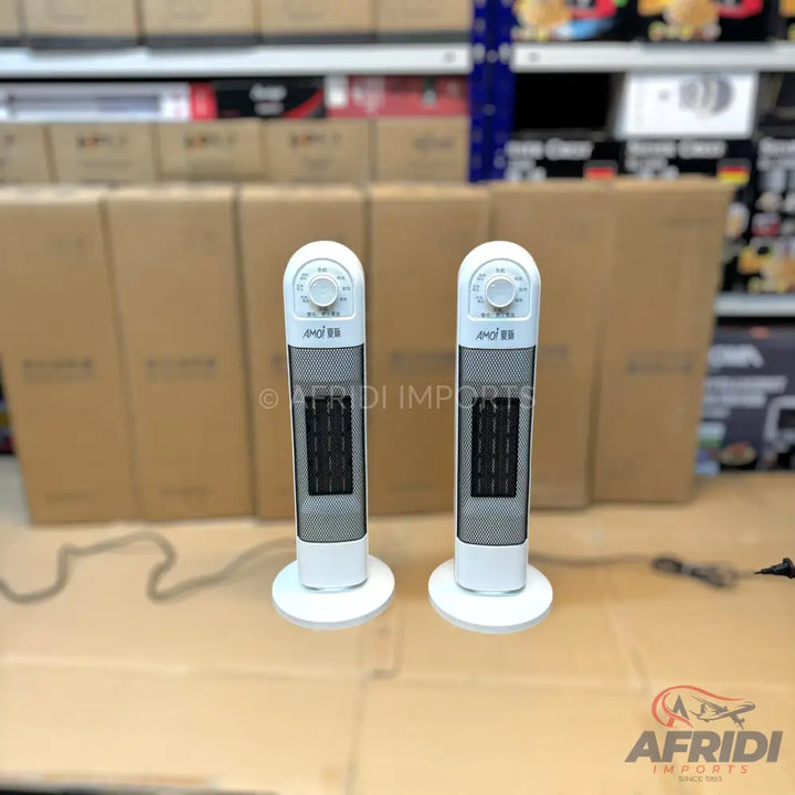 Two white tower heaters with black grilles and top-mounted control knobs.