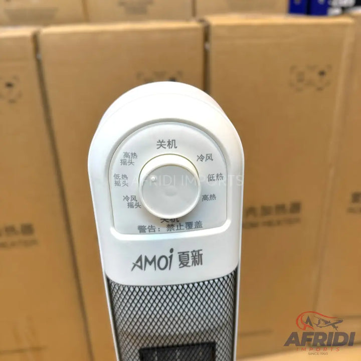 White electric heater with a control knob for temperature and oscillation settings.