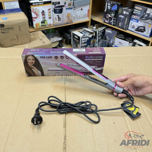 A hair straightener with pink plates and a gray body, accompanied by its power cord with a two-pronged plug.