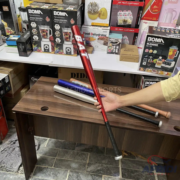 Red metal baseball bat with a black grip.