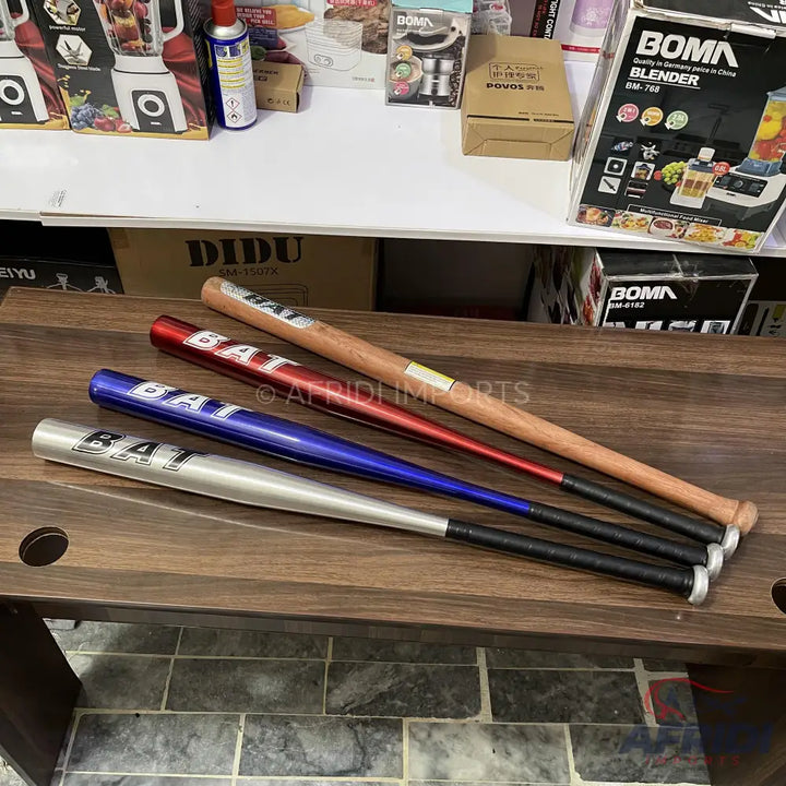 Four baseball bats in different colors and materials.