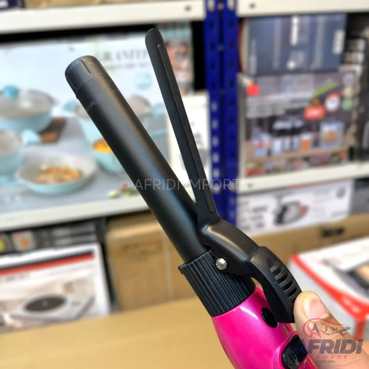 Pink and black curling iron with a clamp.
