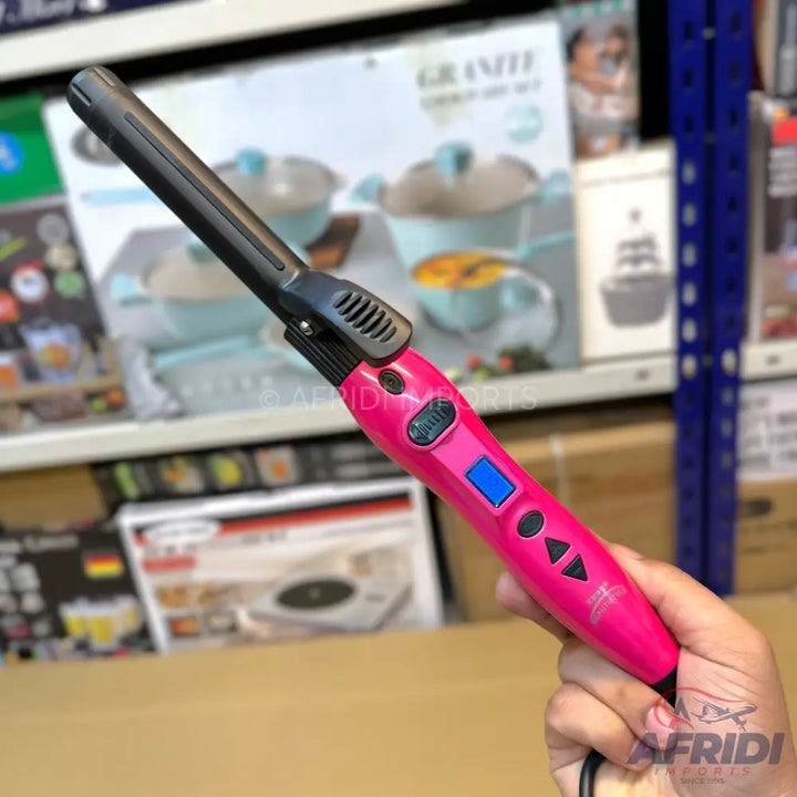 Pink hair curling iron with a digital display.