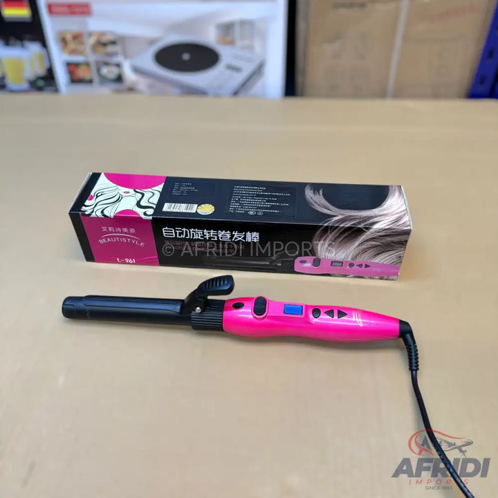 Pink and black automatic rotating hair curler.