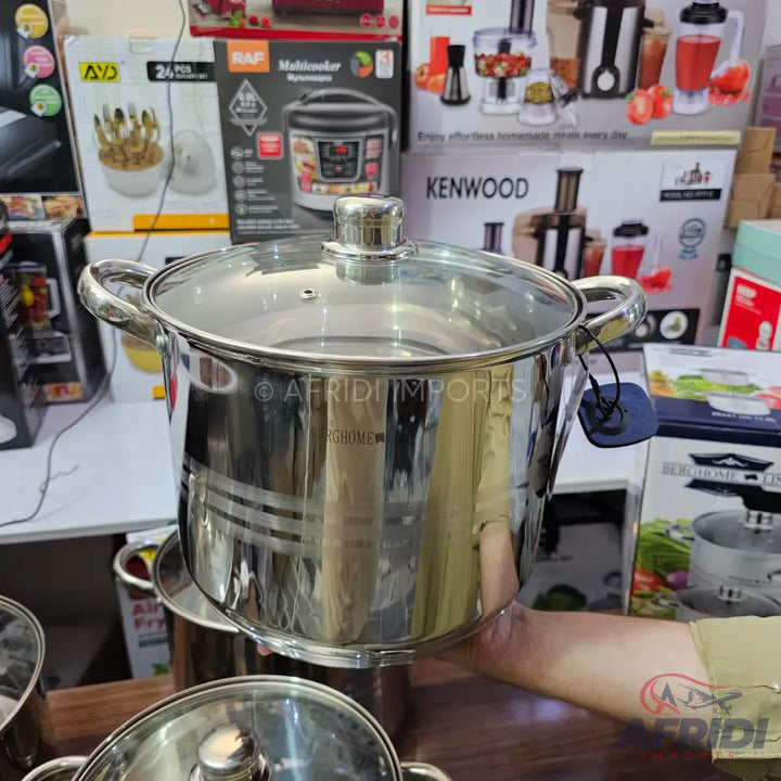 Stainless steel cooking pot with a glass lid.