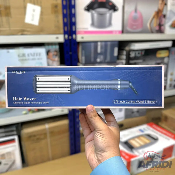 A hair waver with a three-barrel design for creating waves.