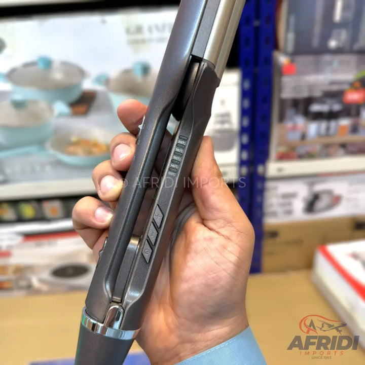 Gray hair straightener with temperature control buttons.