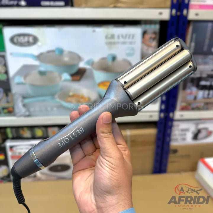 Triple barrel hair waver in dark gray.