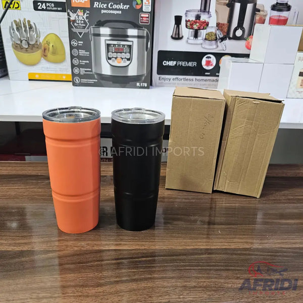 Two insulated tumblers, one orange and one black, with clear lids.