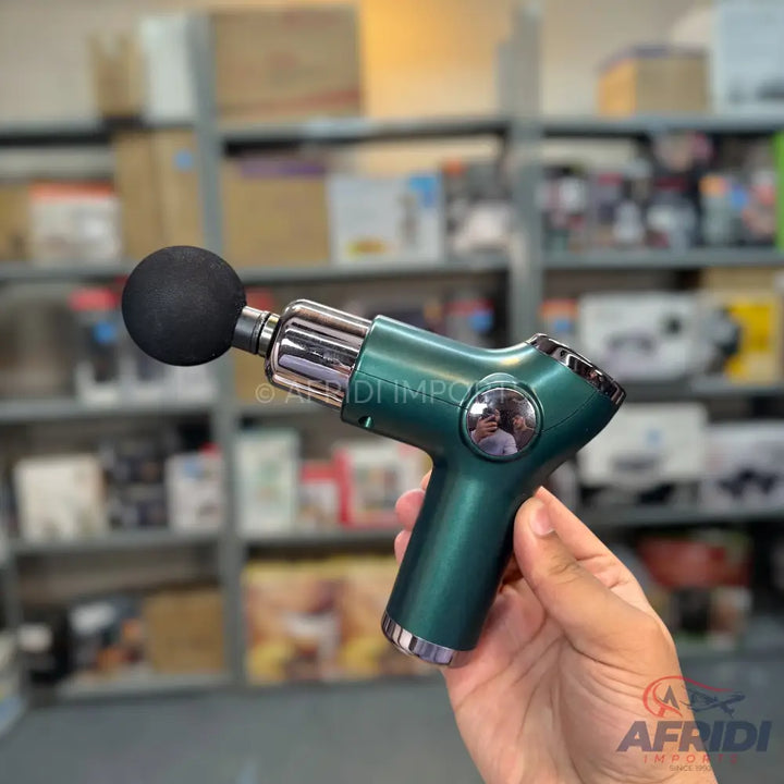 Dark green handheld massage gun with a black spherical attachment.