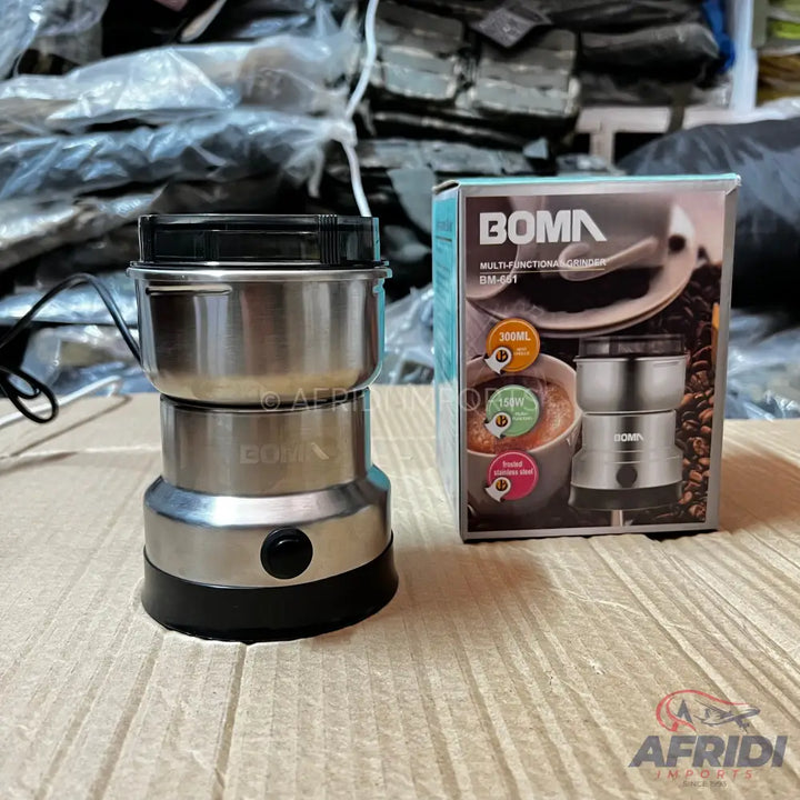 A stainless steel coffee grinder with a black base and lid, packaged in a box that highlights its multi-functional capabilities.