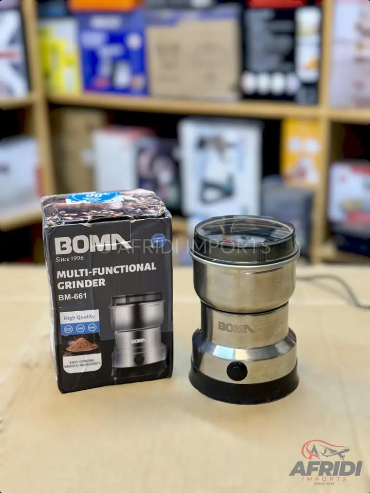 A stainless steel electric multi-functional grinder with a transparent lid and a separate grinding cup.