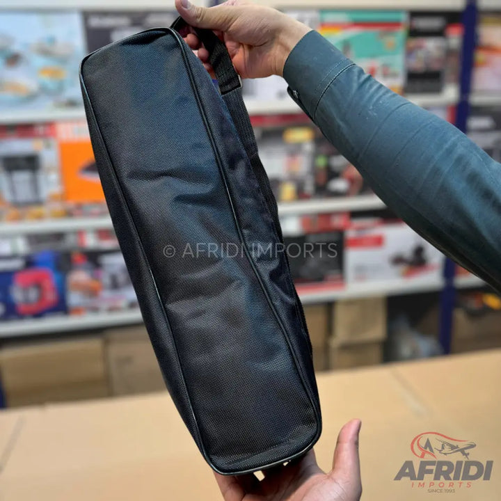 Black rectangular carrying case with a top handle and shoulder strap.