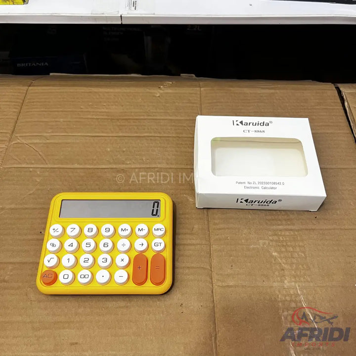 Yellow and white calculator with orange buttons.