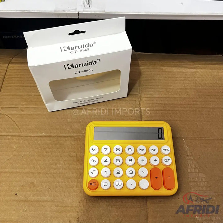 Yellow desktop calculator with white and orange buttons.