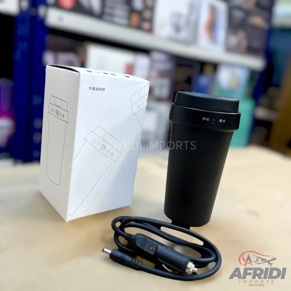 A black portable electric mug with a car charger.