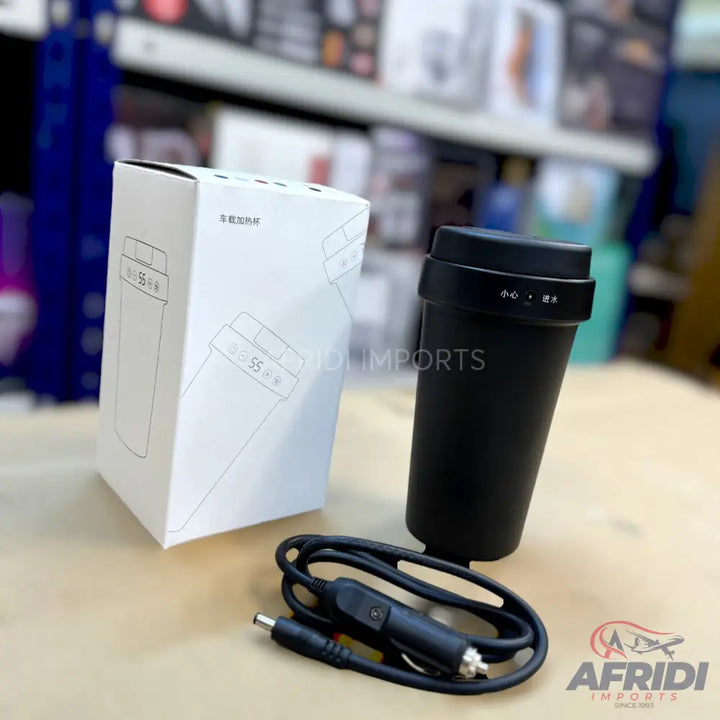 A black portable electric mug with a car charger.