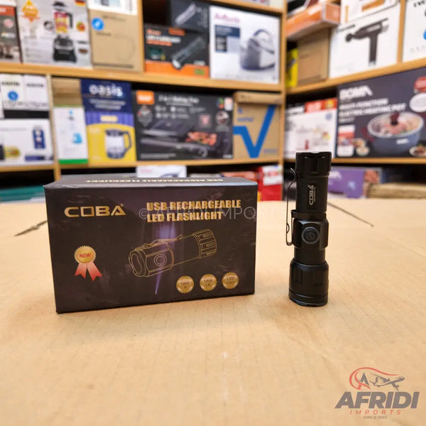 A black USB rechargeable LED flashlight and its packaging.