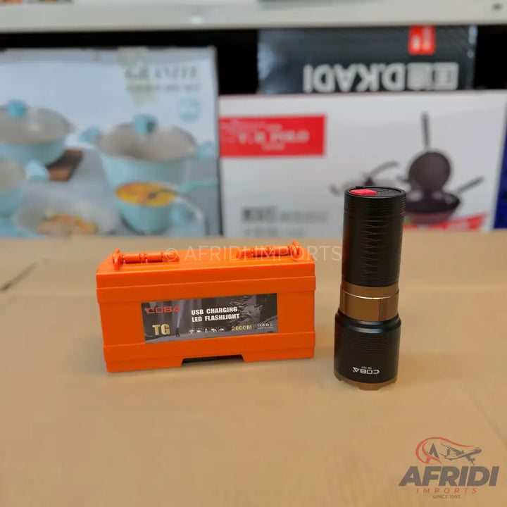 An orange USB charging LED flashlight in a protective case.