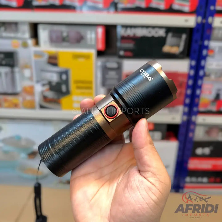 Black and bronze rechargeable LED flashlight with a wrist strap.