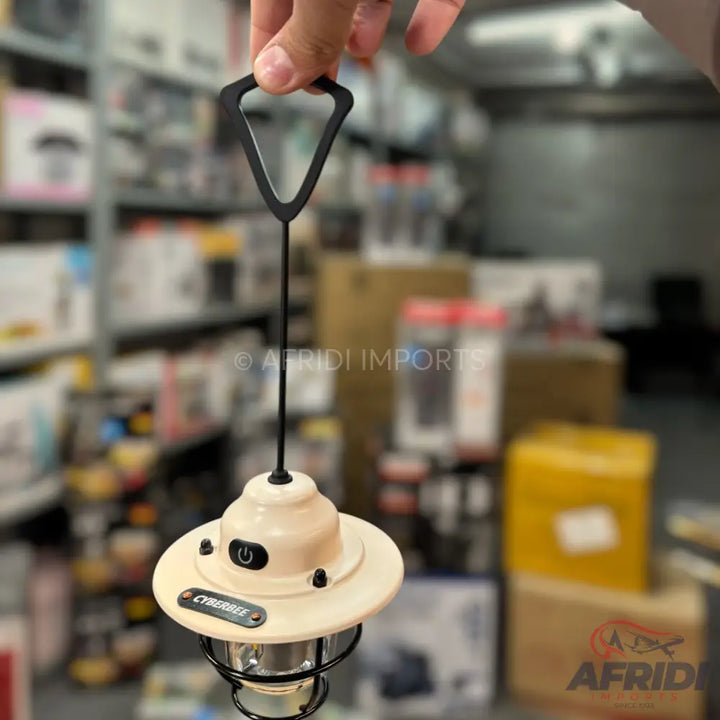 A handheld vintage-style camping lantern with a power button.