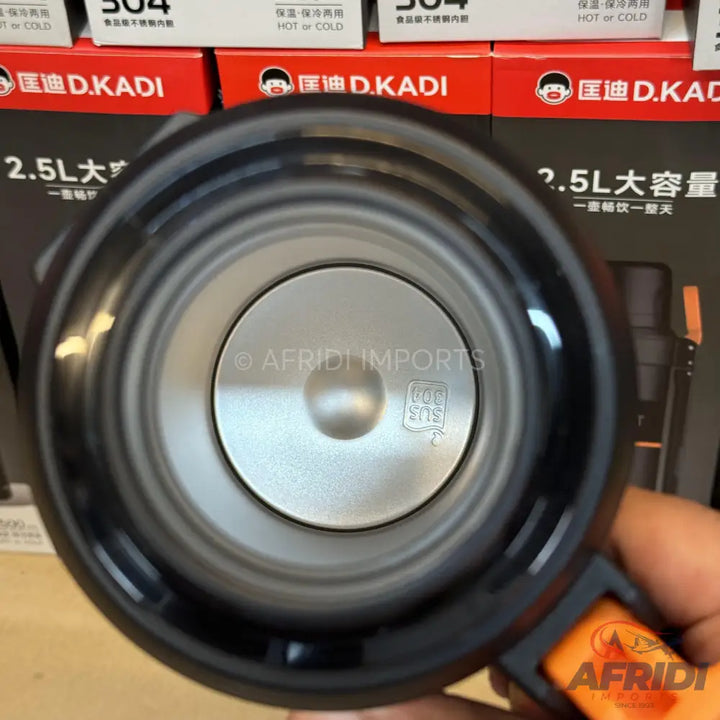 The interior of a black and silver thermal flask.
