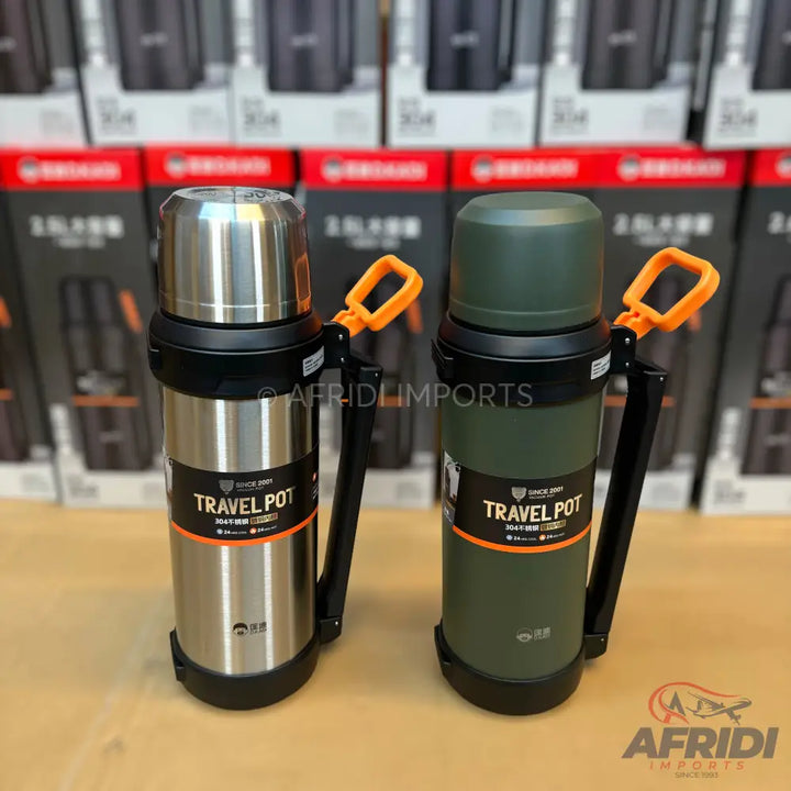 Two insulated travel pots, one silver and one green, each with an orange handle.