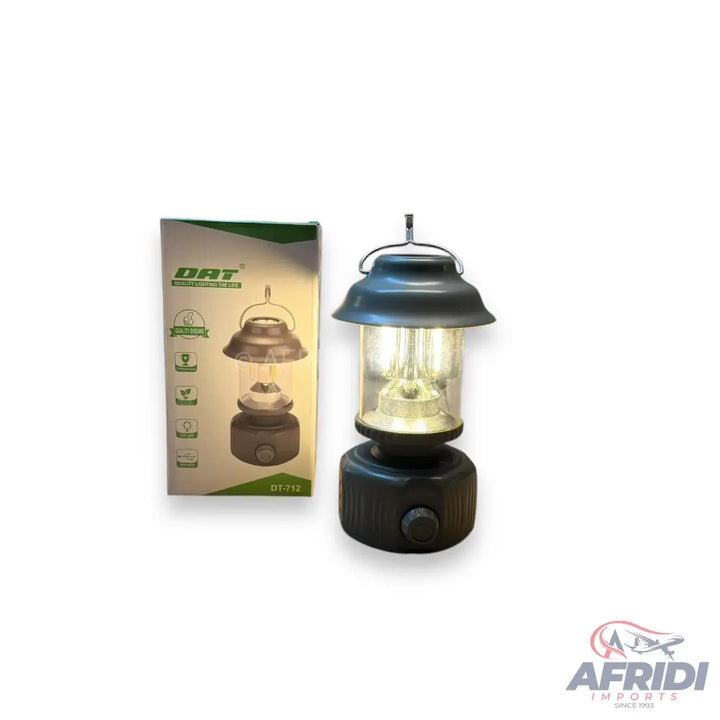 A portable black camping lantern with a clear glass enclosure and a dimmable light.