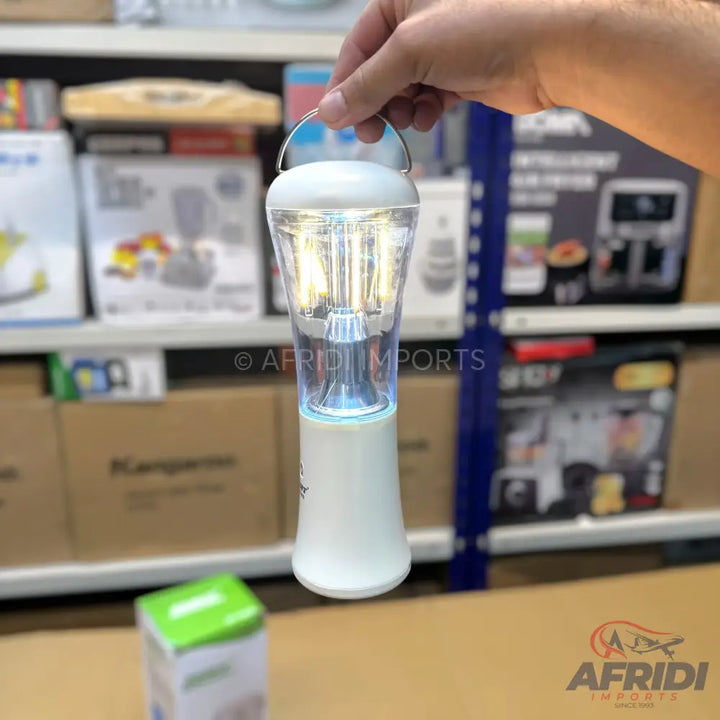 Portable white blender with a clear, illuminated cup.
