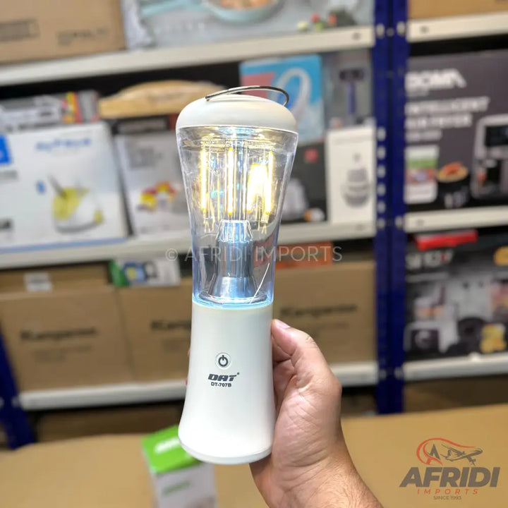 Portable USB rechargeable blender with a clear mixing cup and illuminated blades.