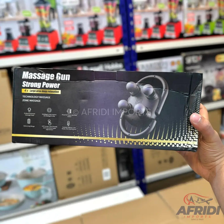 Black box for a ’Massage Gun Strong Power’ device, featuring an illustration of a massage tool with four spherical heads.