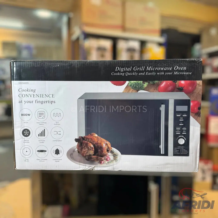 Boxed digital grill microwave oven with a roasted chicken on a plate depicted on the front.
