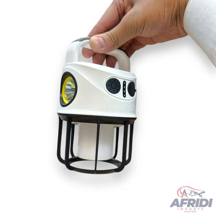 White handheld lantern with a spotlight and side panel controls.