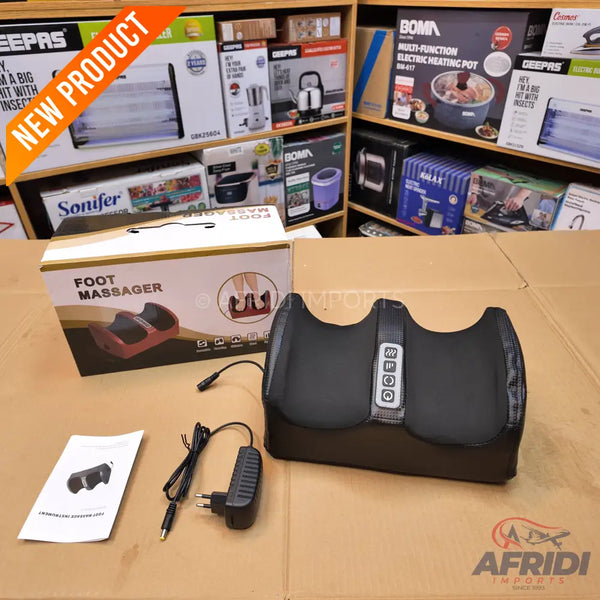 Black, dual-foot massager with power adapter and instruction manual.