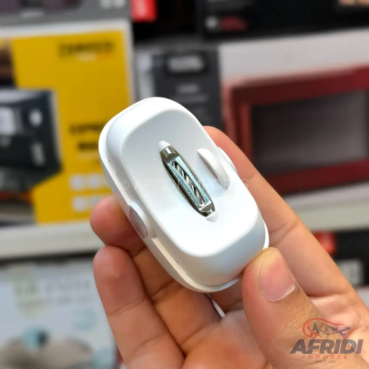 A small, white, portable, and rechargeable electric fan with a visible blade and a clip.