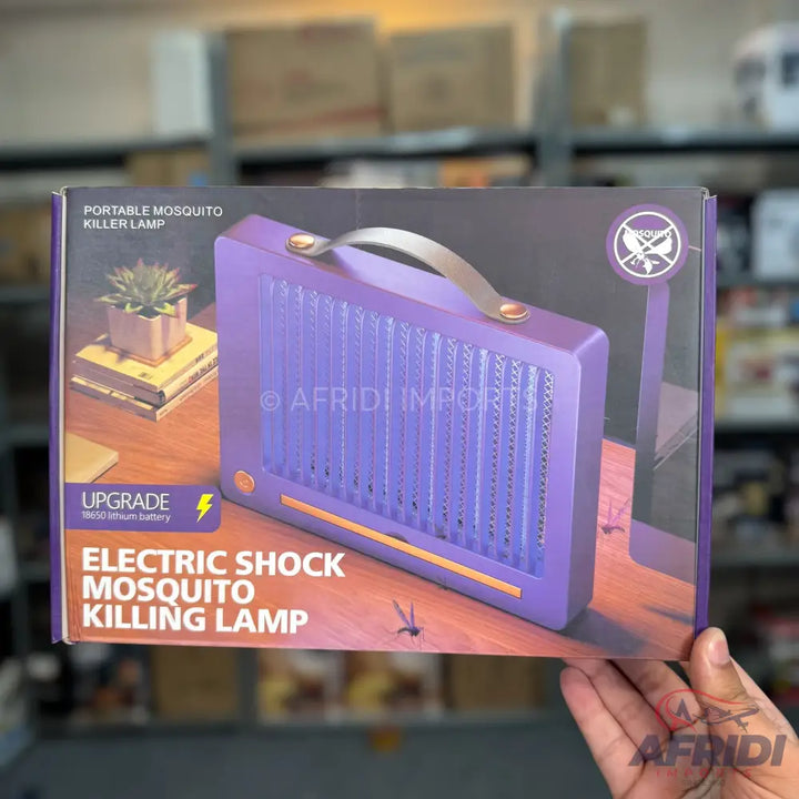 Purple portable electric mosquito killer lamp with a brown handle.