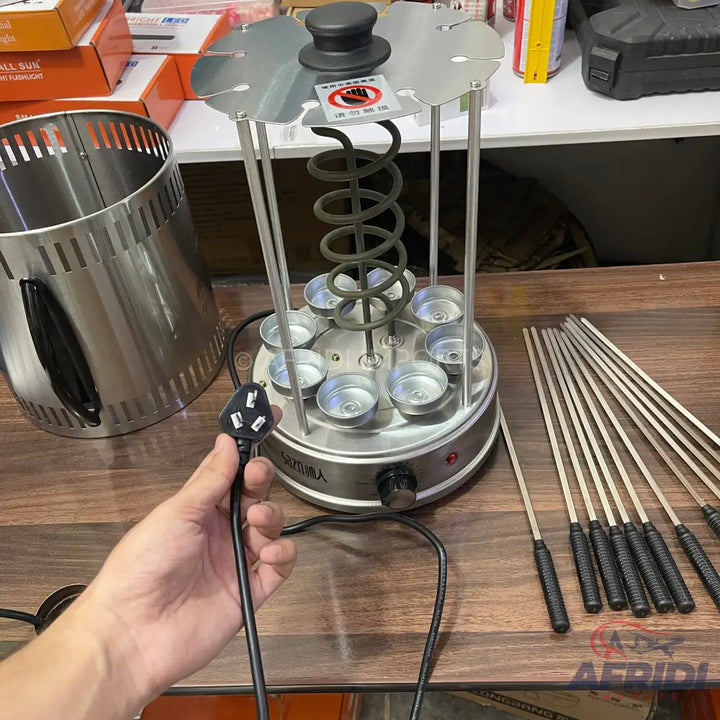Stainless steel vertical rotisserie grill with eight skewers.