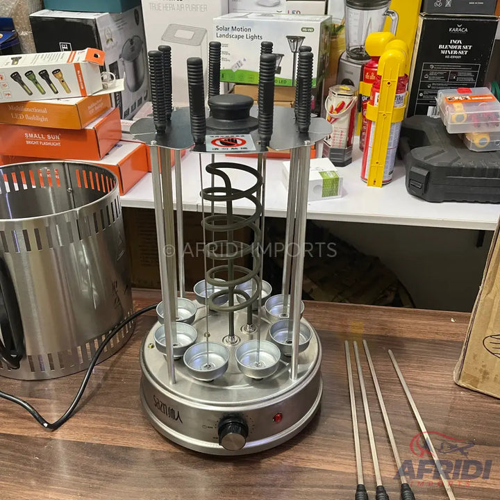 Stainless steel vertical rotisserie machine with eight skewers.