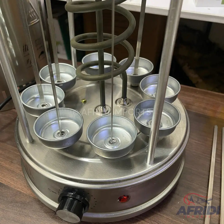 Stainless steel multi-skewer rotisserie with a heating element and temperature control.
