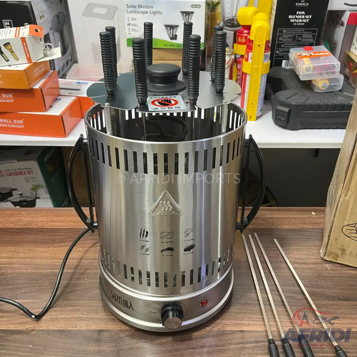 Stainless steel vertical rotisserie grill with multiple skewers.