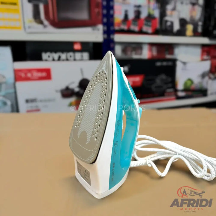 A white and teal steam iron with a grey soleplate and a white power cord.