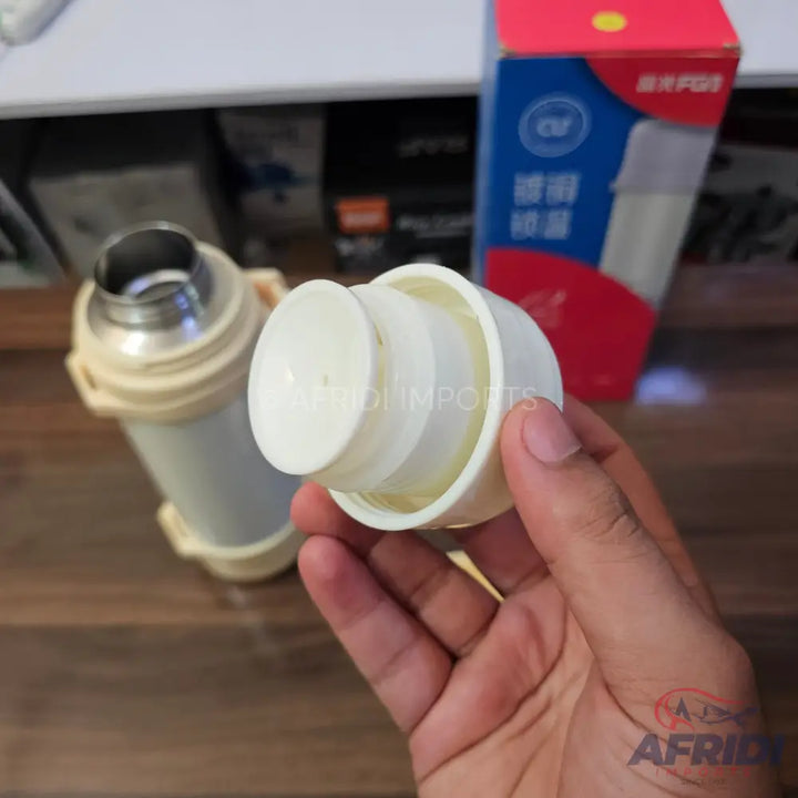 A plastic replacement pump dispenser for a thermos.