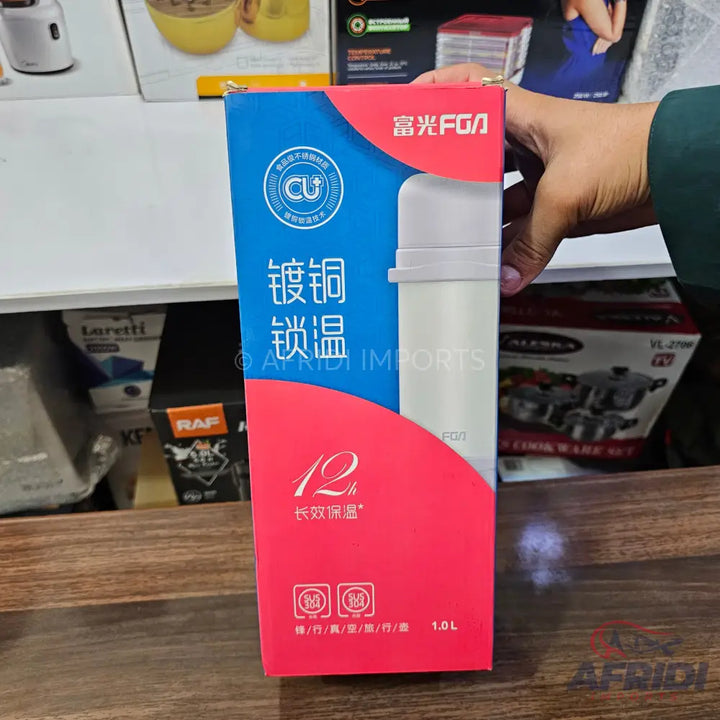 A white insulated thermos bottle in a blue and red box.